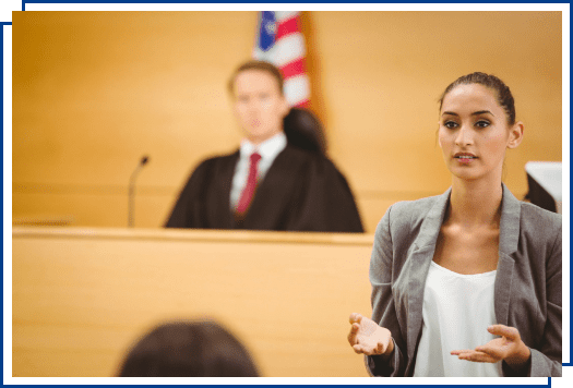 Woman in courtroom talking to jury.