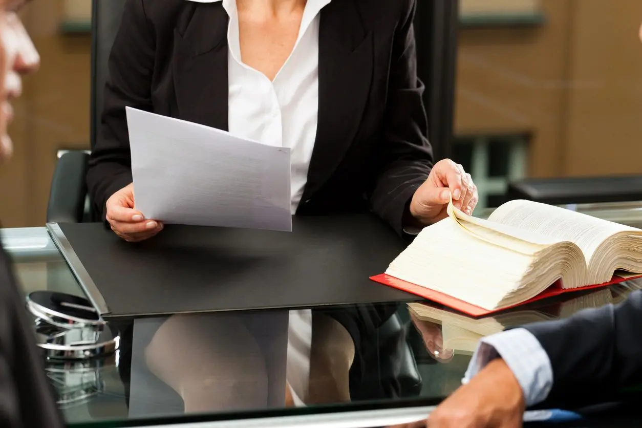 Lawyer reviewing documents with client.