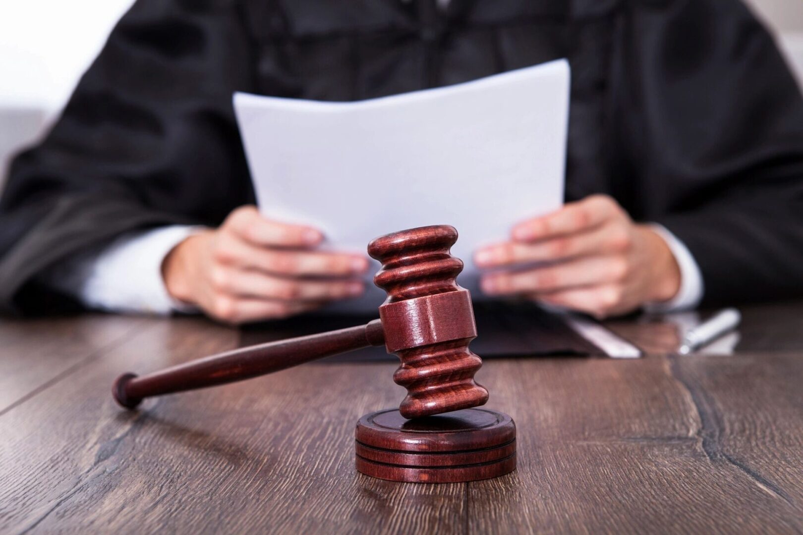 Judge's gavel on a wooden table.