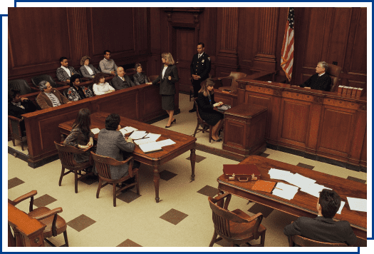 People in a courtroom during a trial.