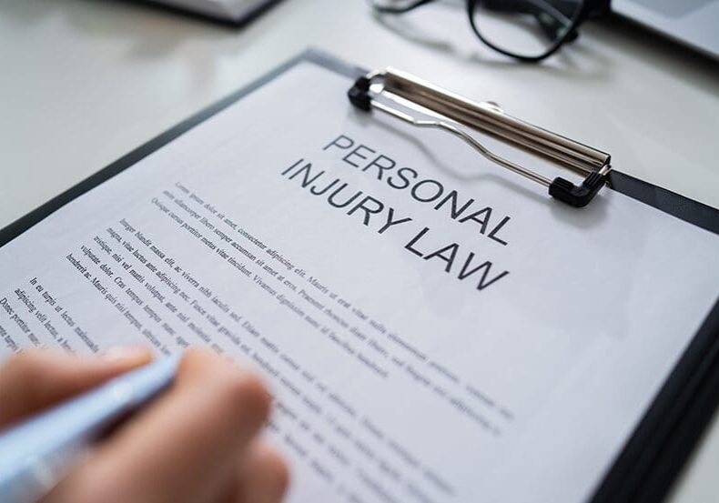 Personal injury law document with hand.